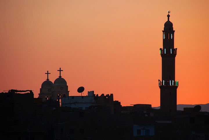 Islam and Christianity. A mosque minaret and a church dome. Image credit: David Evers / Flickr