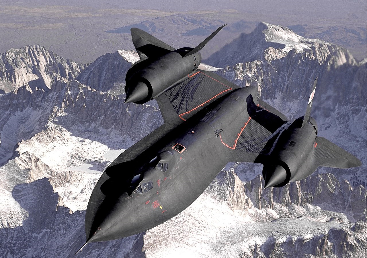 The SR-71B Blackbird, flown by the Dryden Flight Research Center as NASA 831, slices across the snow-covered southern Sierra Nevada Mountains of California after being refueled by an Air Force tanker during a 1994 flight.