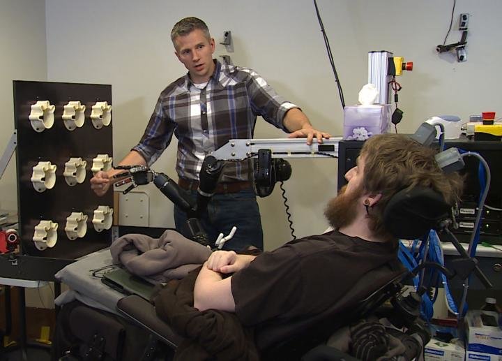 Researcher Rob Gaunt prepares Nathan Copeland for brain computer interface sensory test. Credit: UPMC/Pitt Health Sciences Media Relations OR UPMC/Pitt Health Sciences