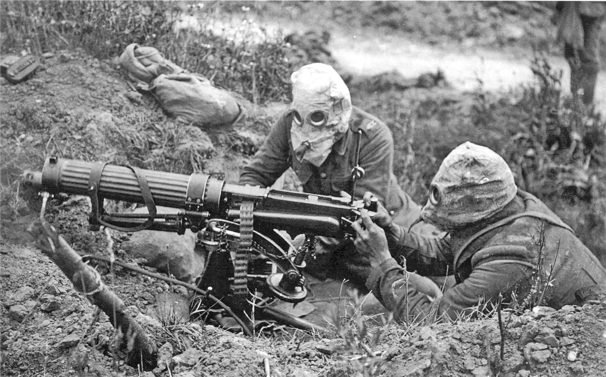 British Vickers machine gun crew wearing PH gas helmets with exhaust tubes